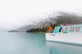 Man Pointing Off Boat